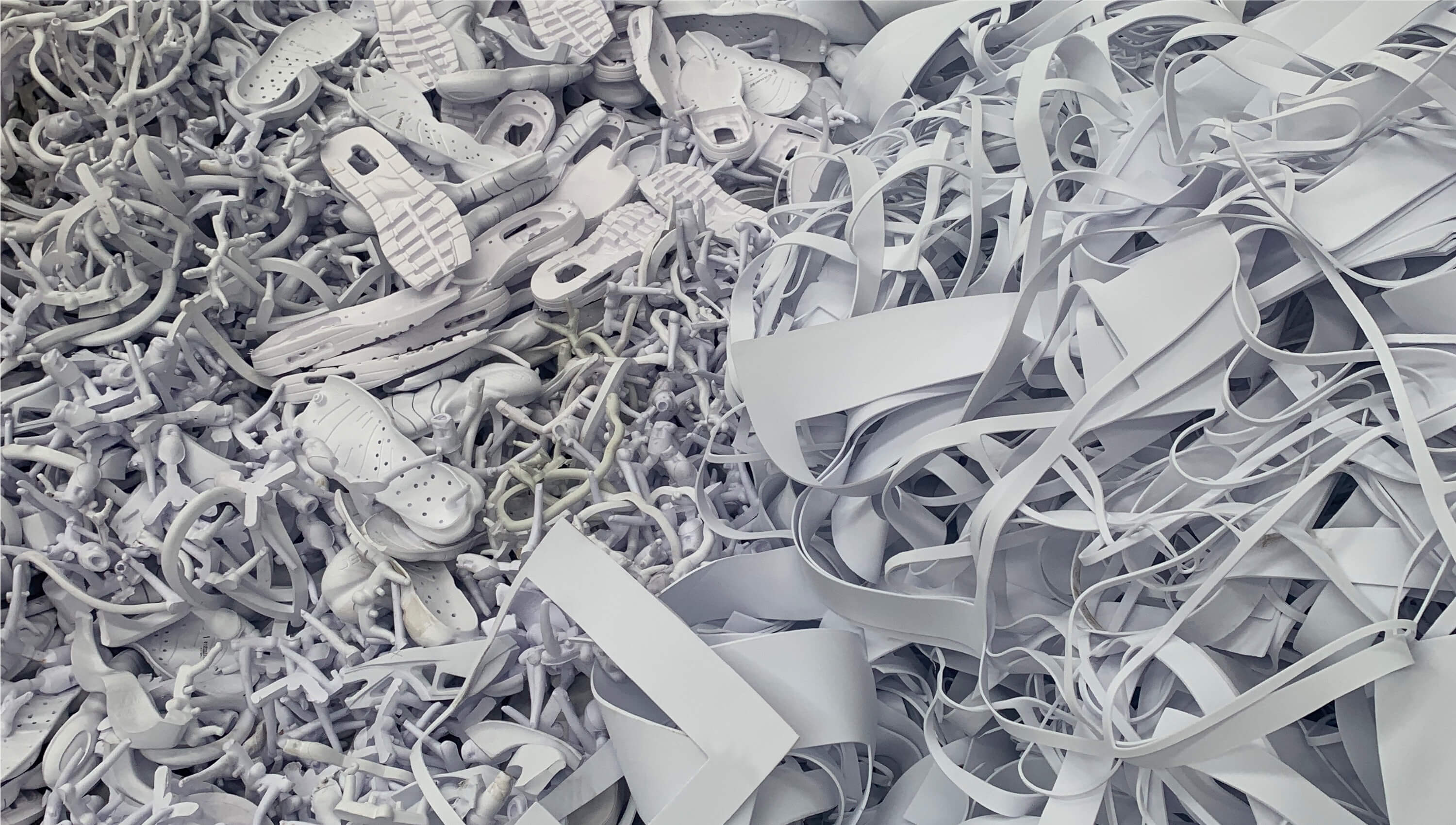 A pile of colorless materials that can be recycled into Nike Grind